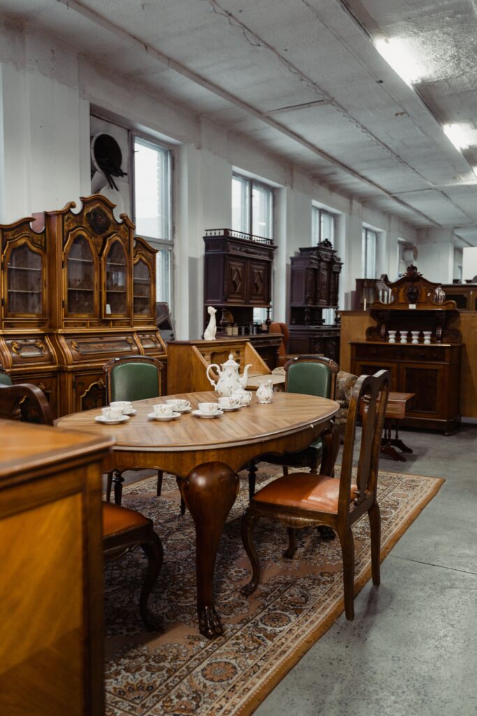 pexels-photo-6826759-6826759 Charming collection of antique wooden furniture in a vintage dining setup.